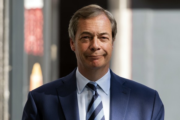 epa07569148 Leader of the Brexit Party, Nigel Farage, leaves the London News Radio - (LBC) talk radio studios after appearing on a radio show in central London, Britain, 14 May 2019. Britain will take ...