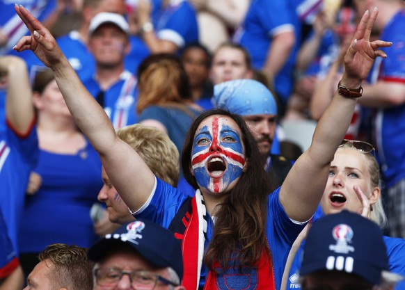 epa05395020 An Iceland fan cheers for her team before the UEFA EURO 2016 round of 16 match between England and Iceland at Stade de Nice in Nice, France, 27 June 2016.

(RESTRICTIONS APPLY: For edito ...