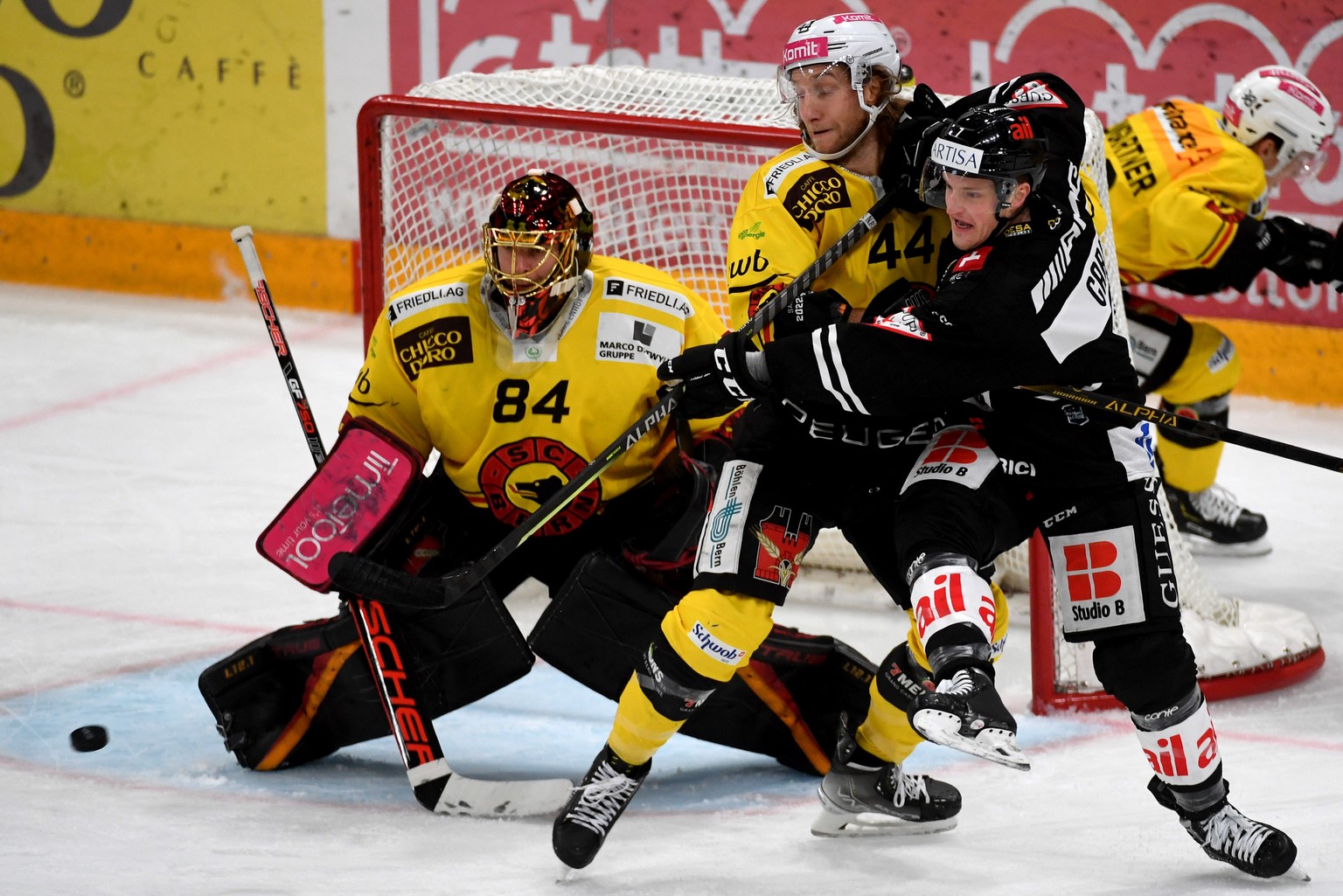 From left Bern&#039;s goalkeper Daniel Manzato, Bern&#039;s player Jesse Zgraggen and Lugano&#039;s player Daniel Carr, during the preliminary round game of National League Swiss Championship 2022/23  ...