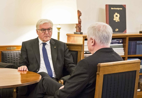 epa06343853 A handout photo made available by the German Government (Bundesregierung) on 22 November 2017 shows German President Frank-Walter Steinmeier (L) talking with Horst Seehofer (R), Bavarian P ...