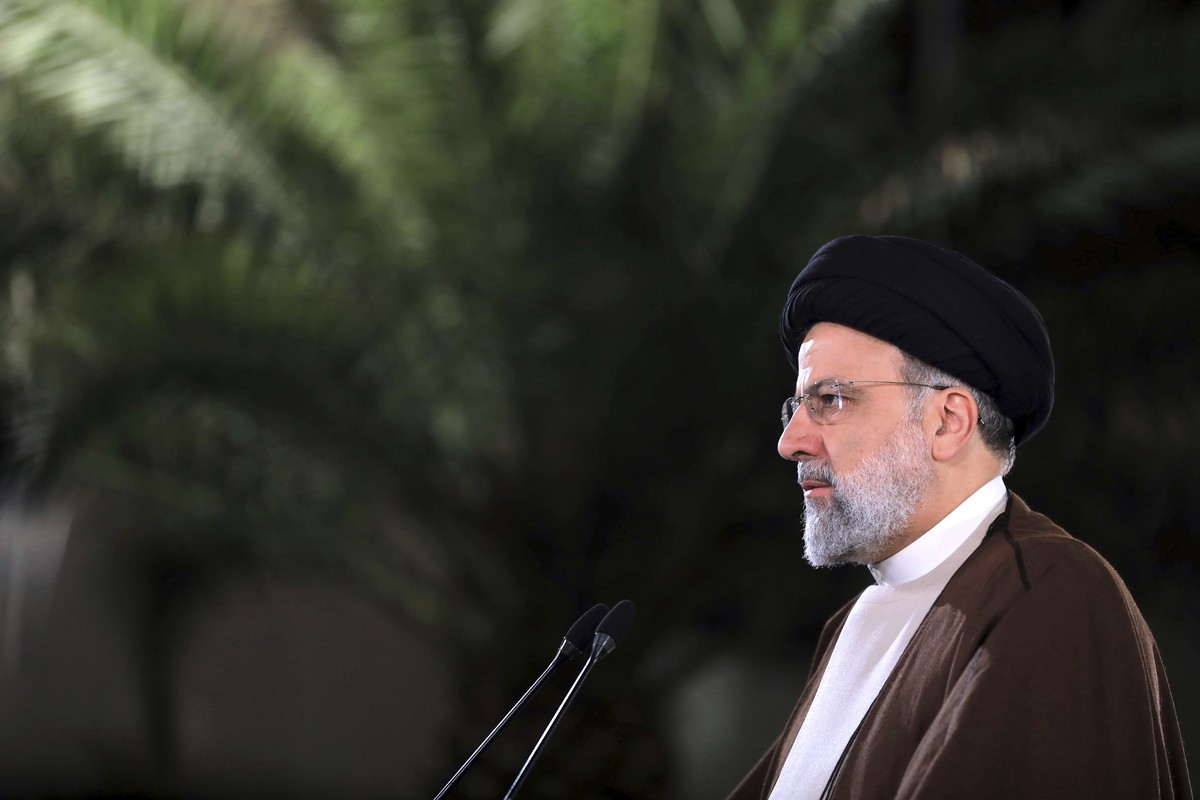 In this photo released on Monday, March 20, 2023, by the office of the Iranian Presidency, President Ebrahim Raisi gives a televised new year message to the nation at the presidency office in Tehran,  ...