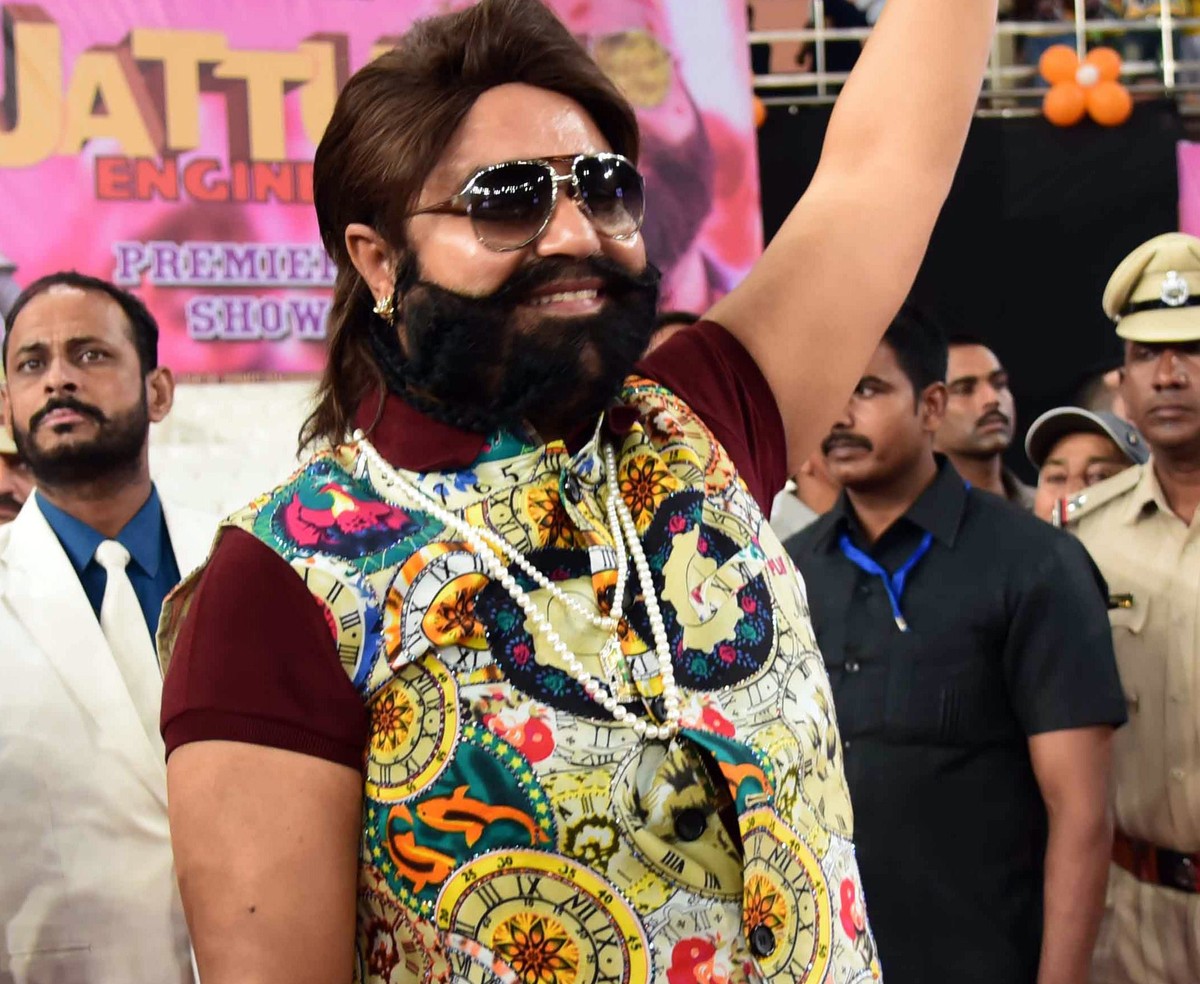 epa06162256 (FILE) - India's self-styled guru and spiritual leader turned actor, Gurmeet Ram Rahim Singh waves during a 'Cow Milk Party', held at the premiere of his movie 'Jattu E ...