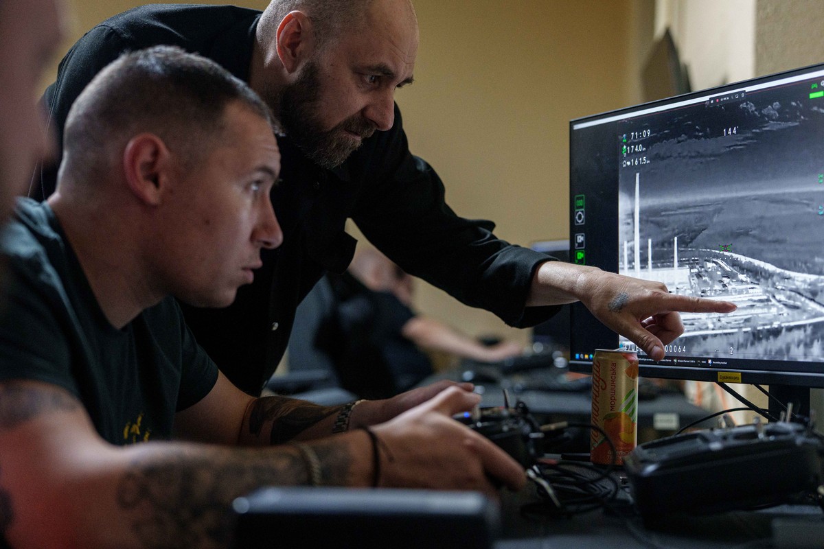 A Ukrainian serviceman of K-2 brigade of the Unmanned Systems Forces operates a midrange drone during a flight towards Russian positions at the frontline, at a command center in undisclosed location,  ...