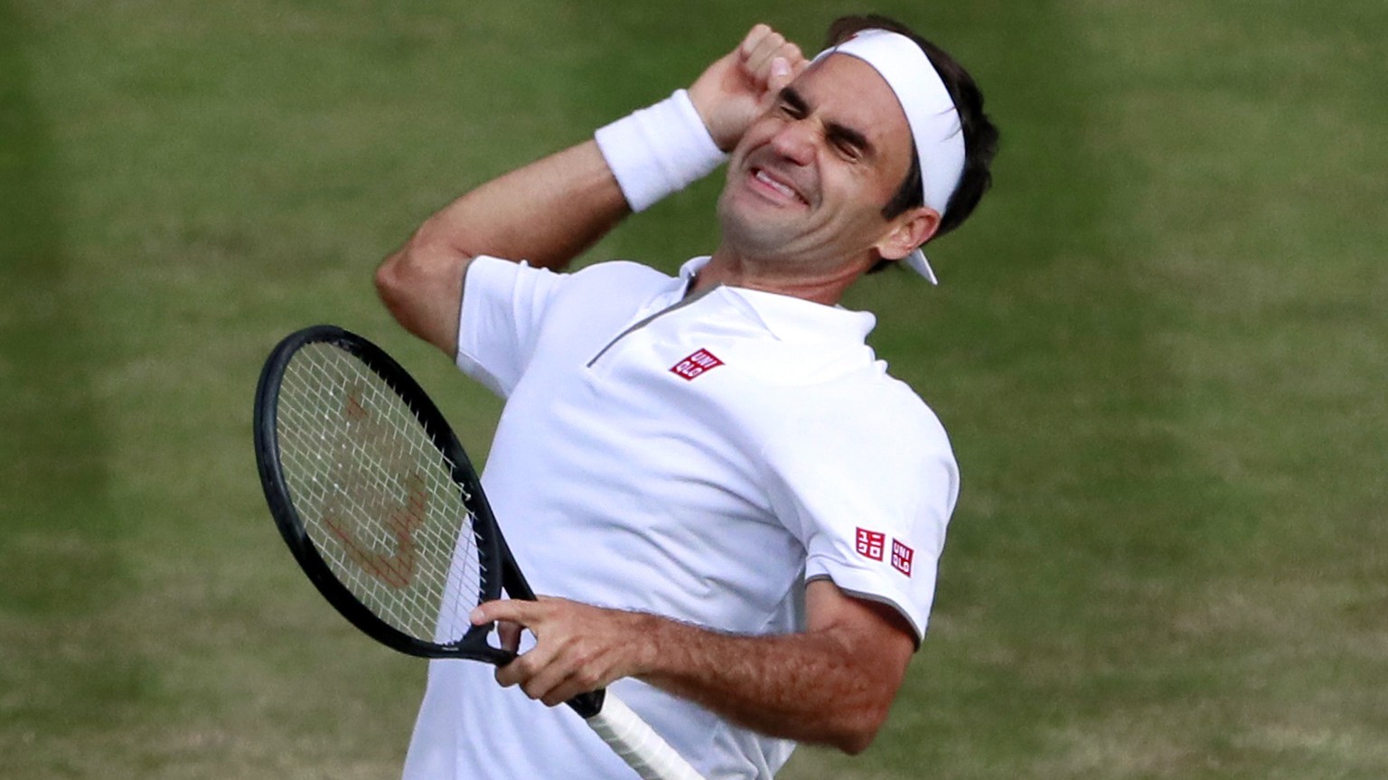 epa07713112 Roger Federer of Switzerland celebrates his win over Rafael Nadal of Spain in their semi final match during the Wimbledon Championships at the All England Lawn Tennis Club, in London, Brit ...