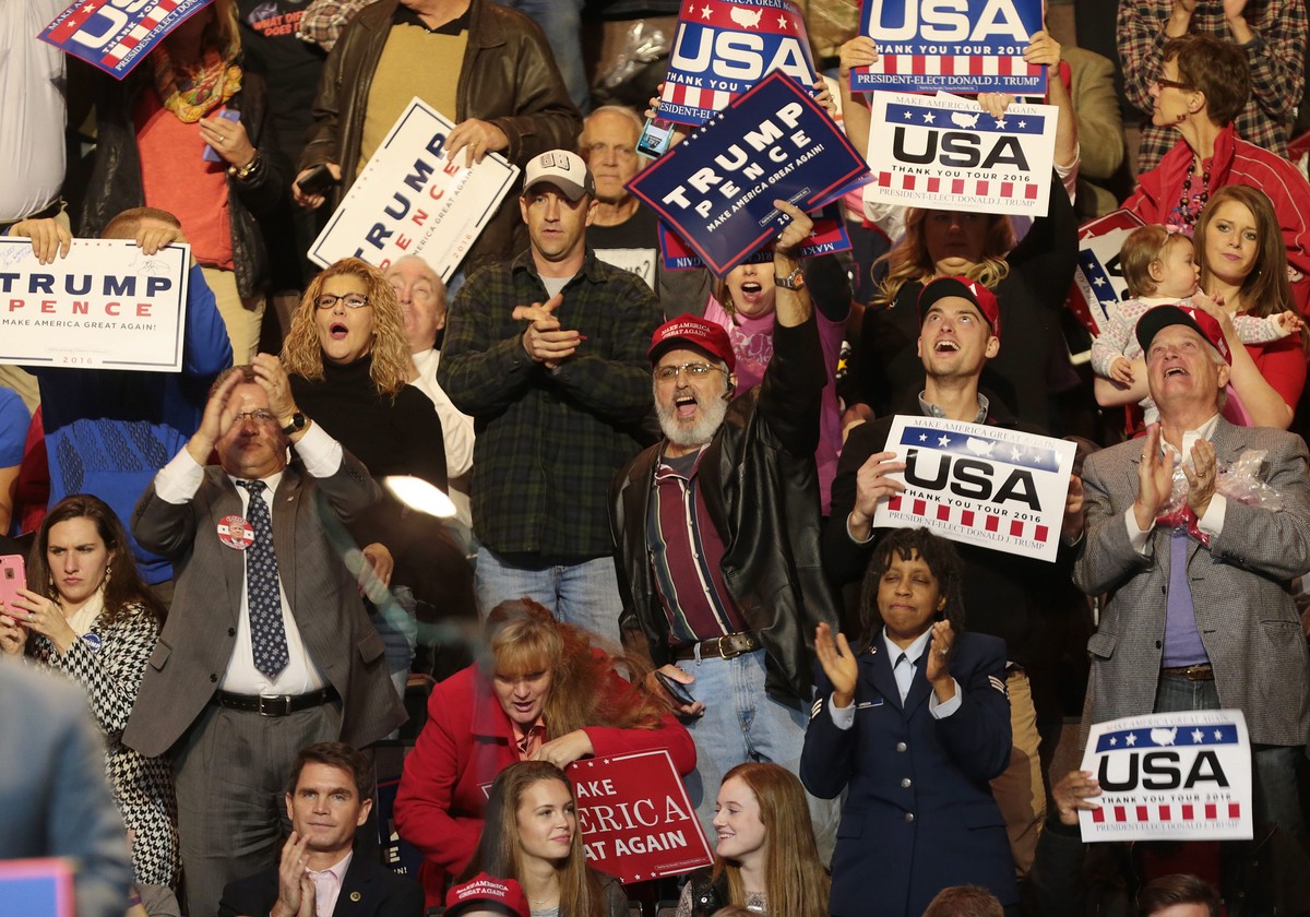 epa05655899 Supporters cheer US President-elect Donald Trump (not pictured) as he speaks during the first stop of his 'USA Thank You Tour 2016' rally at US Bank Arena in Cincinnati, Ohio, US ...