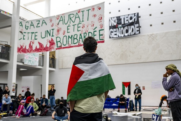 epa11325062 Pro-Palestinian students occupy part of the SG building of the Swiss Federal Institute of Technology of Lausanne (EPFL) in Lausanne, Switzerland, 07 May 2024. The banner (L) reads &#039;In ...