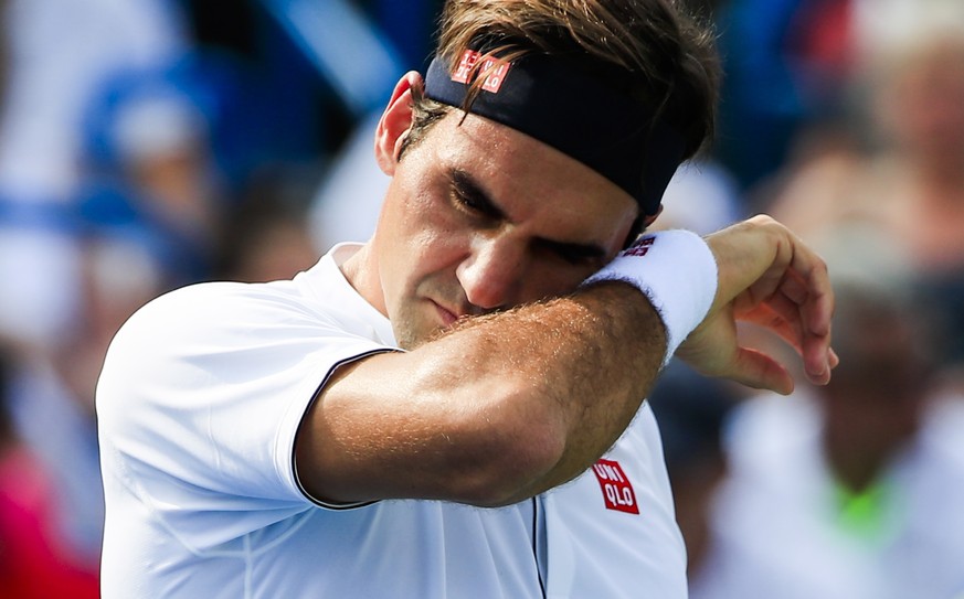 epa06959164 Roger Federer of Switzerland in action against Novak Djokovic of Serbia in their final match in the Western &amp; Southern Open tennis tournament at the Lindner Family Tennis Center in Mas ...