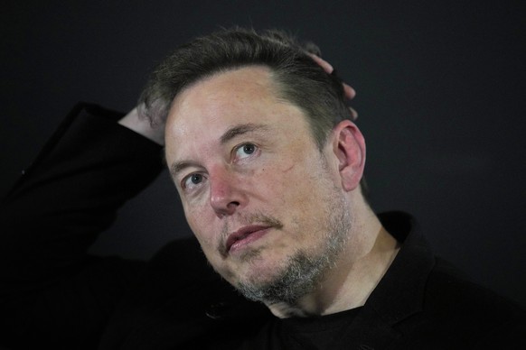 FILE - Elon Musk appears at an event with British Prime Minister Rishi Sunak in London, on November 2, 2023. Musk is suing OpenAI and its CEO Sam Altman for what he says is a betrayal of the ChatG...