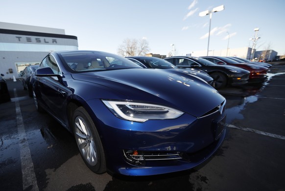 FILE - In this Sunday, Feb. 3, 2019, file photograph, an unsold 2019 S75D sits at a Tesla dealership in Littleton, Colo. Tesla&#039;s assembly lines slowed down during a rocky start to the new year, w ...