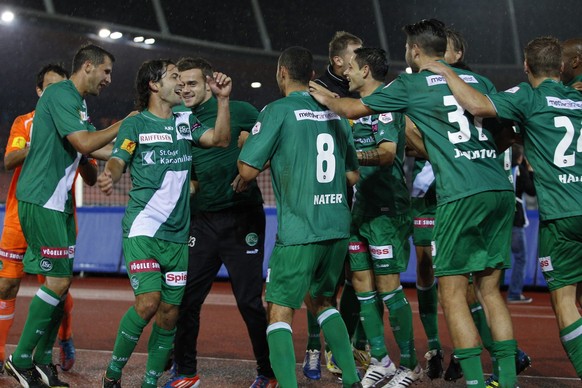 FC St.Gallen players celebrate a victory in the Super League soccer match between FC Zurich (FCZ) and FC St.Gallen (FCSG) at the Letzigrund stadium in Zurich, Switzerland, Wednesday, September 26, 201 ...