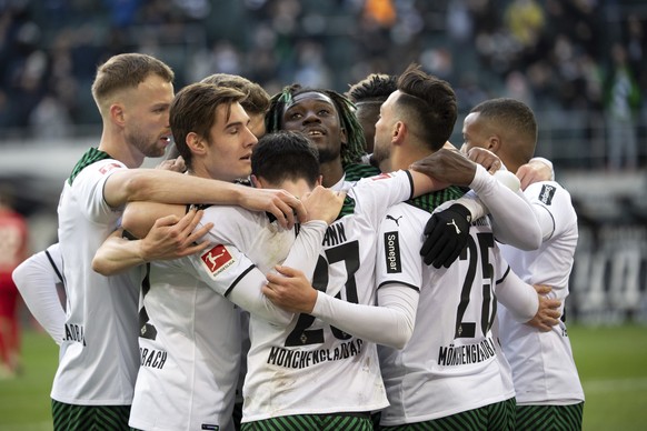 Moenchengladbach&#039;s players celebrate their side third goal during the German Bundesliga soccer match between Borussia Moenchengladbach and FC Augsburg in Moenchengladbach, Germany, Saturday, Feb. ...
