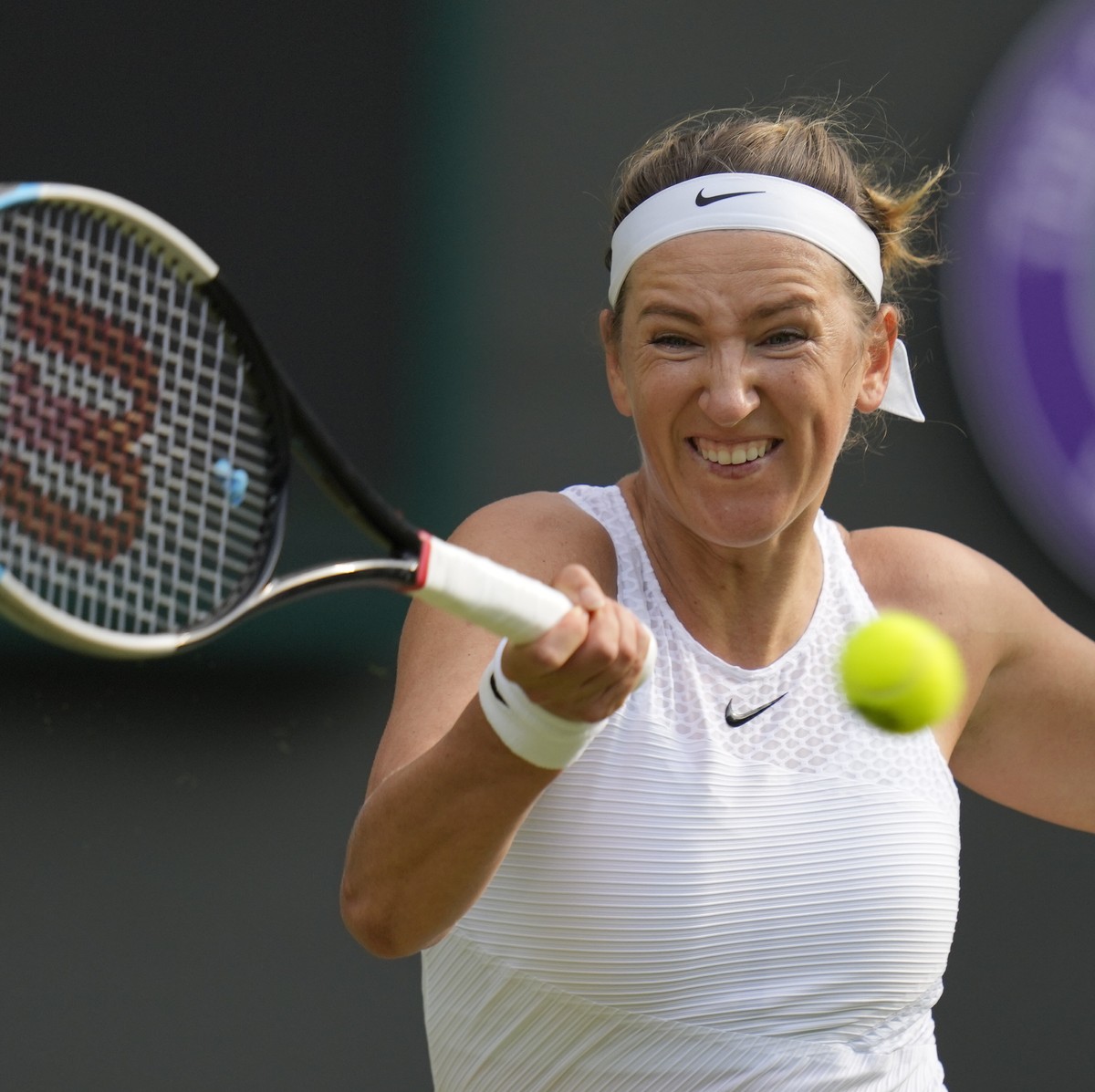 FILE - Victoria Azarenka of Belarus plays a return to Romania's Sorana Cirstea during the women's singles second round match on day four of the Wimbledon Tennis Championships in London, Thur ...