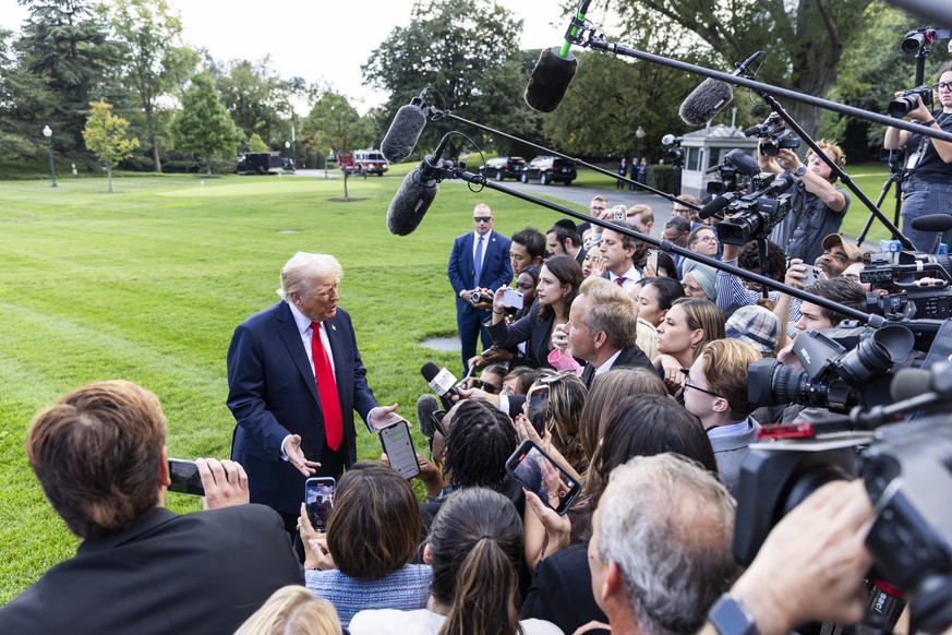 epa12370232 US President Donald Trump speaks to reporters about the murder of Turning Point founder Charlie Kirk as he leaves the White House for New York City in Washington, DC, USA, 11 September 202 ...