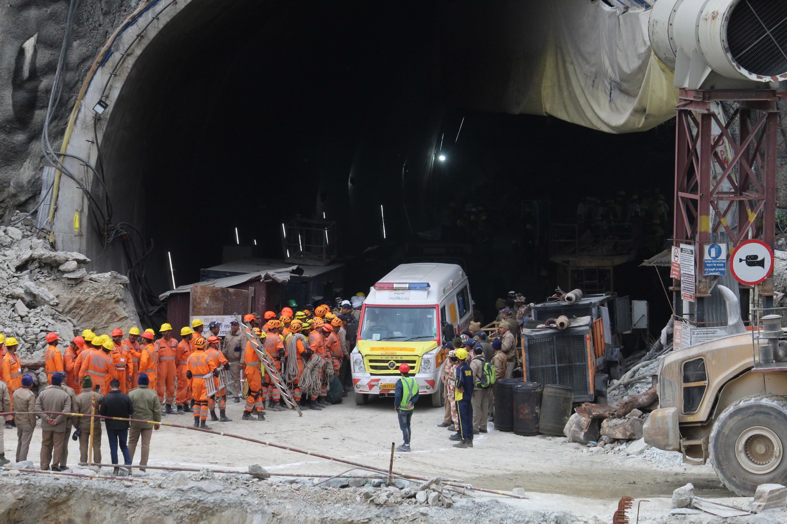 An ambulance waits to carry workers from the site of an under-construction road tunnel that collapsed in Silkyara in the northern Indian state of Uttarakhand, India, Tuesday, Nov. 29, 2023. Officials  ...