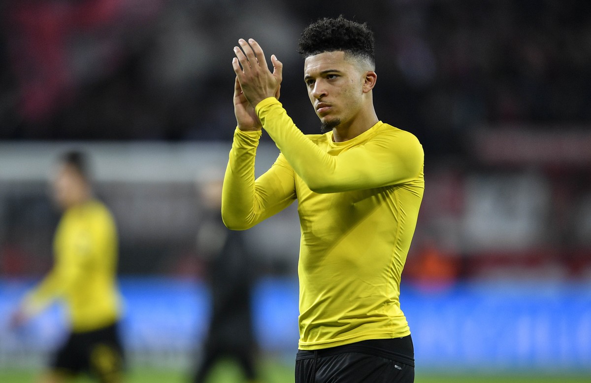Dortmund's Jadon Sancho reacts to fans after the German Bundesliga soccer match between Bayer Leverkusen and Borussia Dortmund in Leverkusen, Germany, Saturday, Feb. 8, 2020. Leverkusen defeated  ...