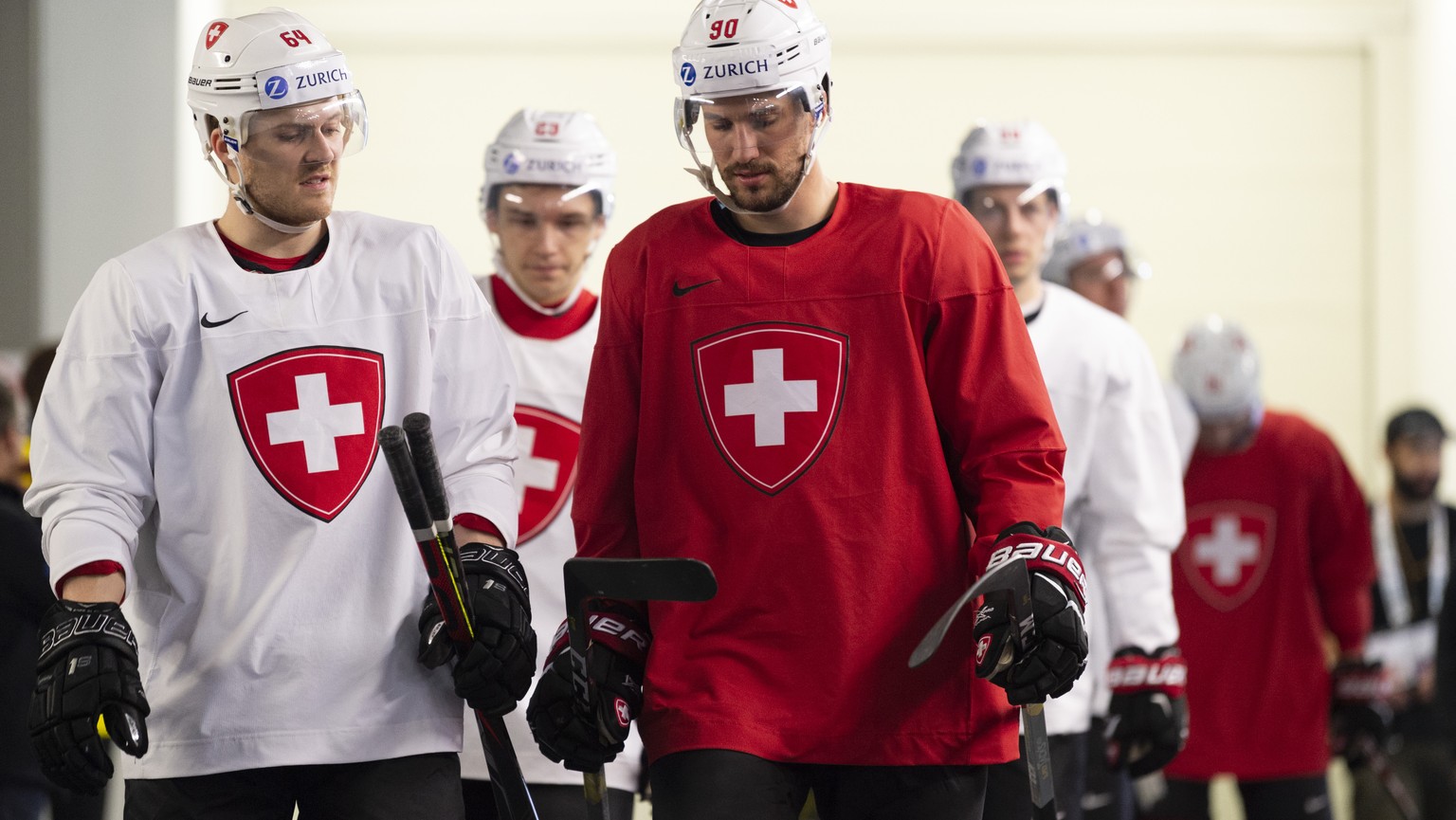 Switzerland&#039;s Christoph Bertschy, left, and Switzerland&#039;s Roman Josi, during a training session of the Swiss team at the IIHF 2019 World Ice Hockey Championships, at the Ondrej Nepela Arena  ...