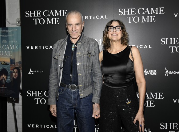 FILE - Writer-director Rebecca Miller, right, and husband Daniel Day-Lewis attend a special screening of &quot;She Came to Me&quot; at Metrograph, Oct. 3, 2023, in New York. (Evan Agostini/Invision/AP ...
