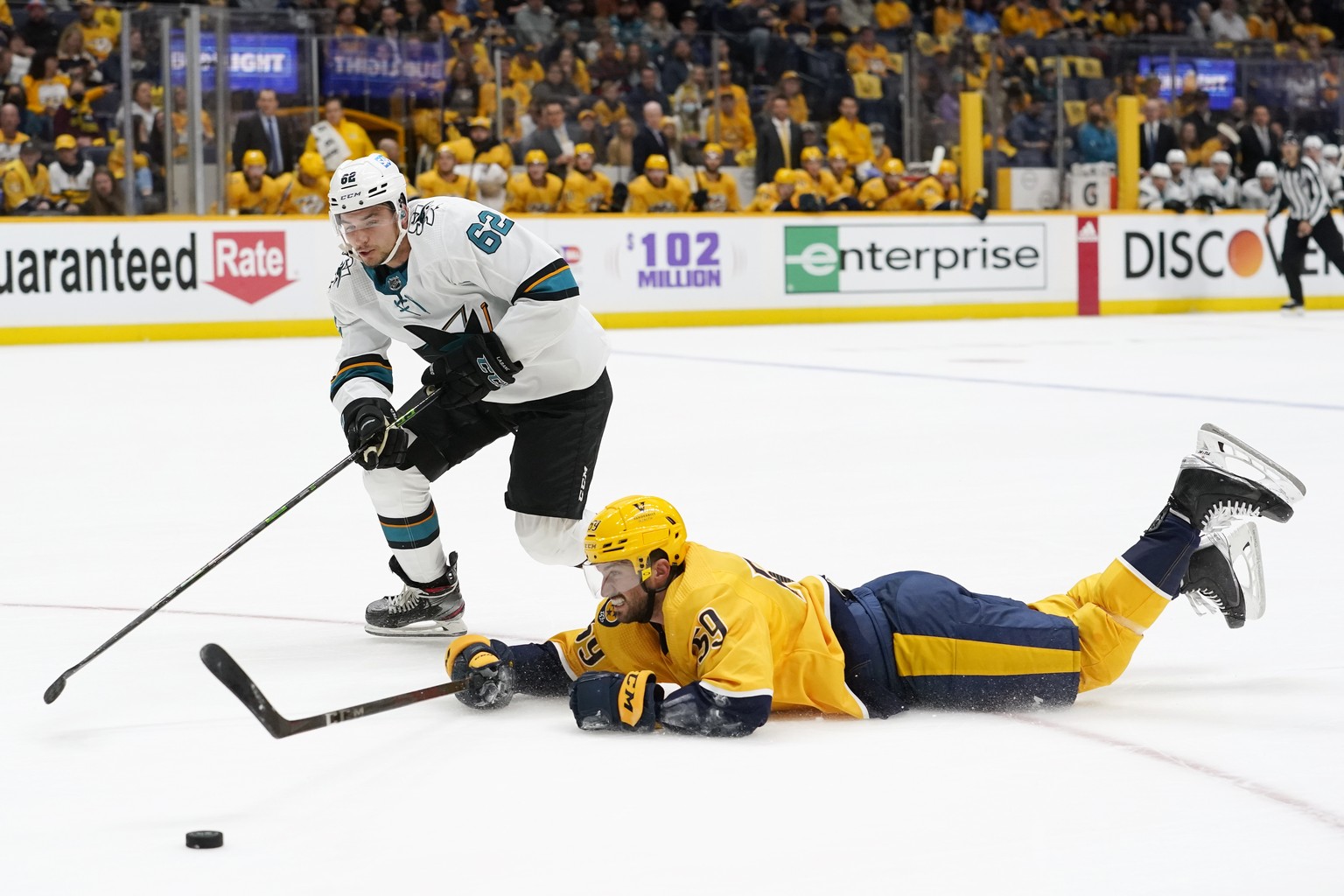 Nashville Predators defenseman Roman Josi (59) slides to block the puck from San Jose Sharks right wing Kevin Labanc (62) in the first period of an NHL hockey game Tuesday, Oct. 26, 2021, in Nashville ...