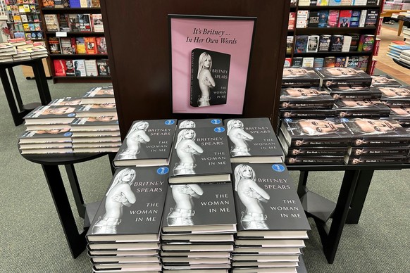 FILE - Britney Spears' memoir "The Woman in Me" is seen at a Barnes &amp; Noble bookstore, in Clifton, N.J., on Nov. 2, 2023. (AP Photo/Ted Shaffrey, File)