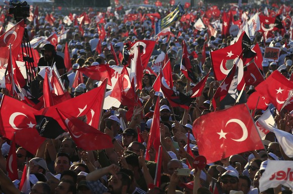 Supporters of Kemal Kilicdaroglu, the leader of Turkey&#039;s main opposition Republican People&#039;s Party, hold Turkish flags as they gather for a rally following their 425-kilometer (265-mile) &#0 ...