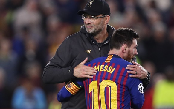 Barcelona&#039;s Lionel Messi, who scored two of the team&#039;s three goals, hugs Liverpool coach Juergen Klopp after the Champions League semifinal first leg soccer match between FC Barcelona and Li ...