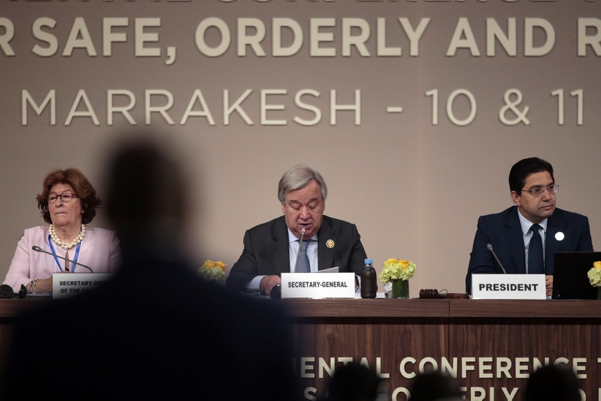 U.N. Secretary-General Antonio Guterres, flanked by Special Representative of the United Nations Secretary-General for International Migration, Louise Arbor, and Moroccan Minister of Foreign Affairs a ...