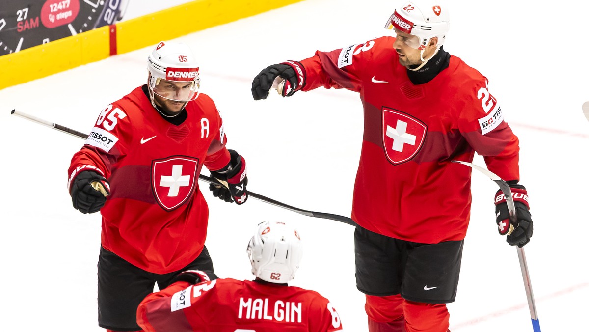 Switzerland's forward Sven Andrighetto, left, celebrates his goal with his teammates Switzerland's forward Denis Malgin #62 and Switzerland's forward Nino Niederreiter, right, after sco ...