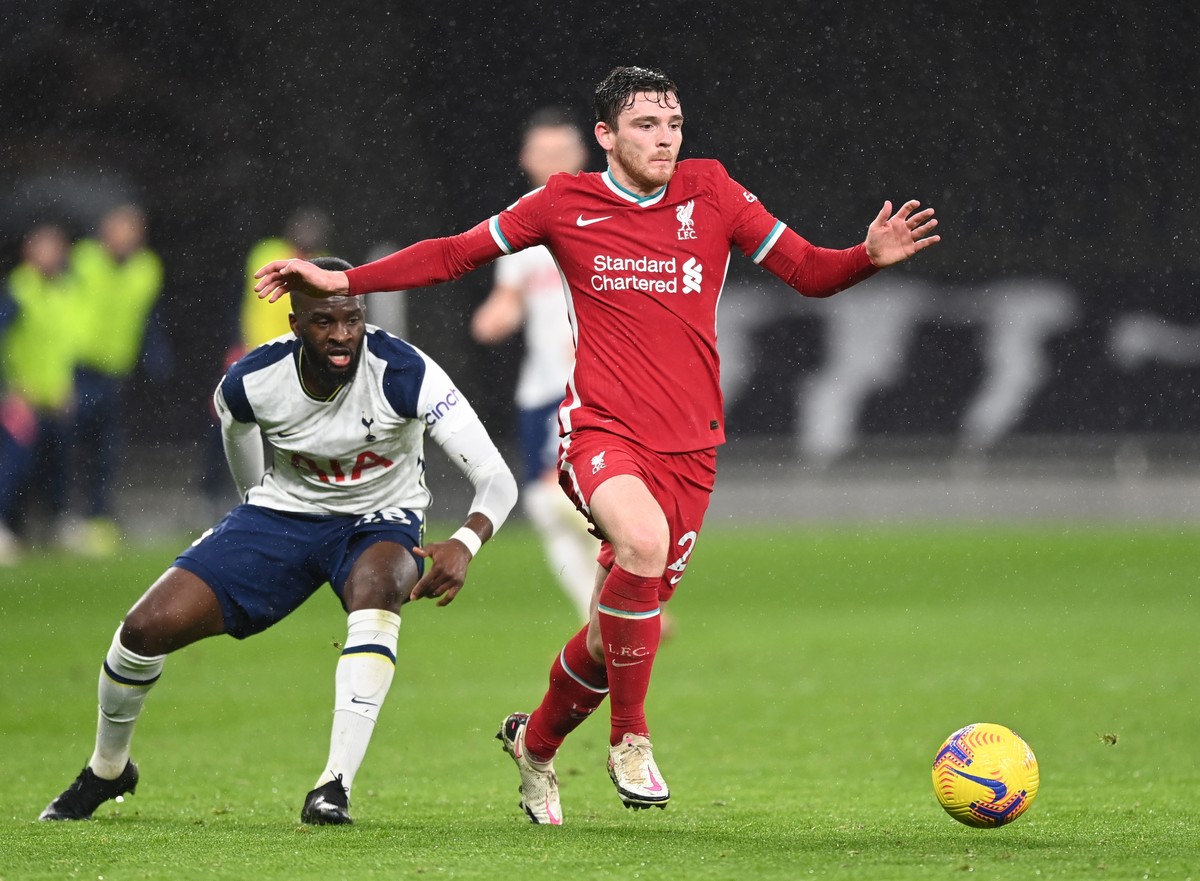 epa08972038 Liverpool's Andrew Robertson (R) in action against Tottenham's Tanguy Ndombele (L) during the English Premier League soccer match between Tottenham Hotspur and Liverpool FC in Lo ...