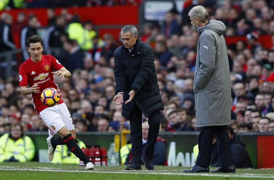 Britain Football Soccer - Manchester United v Arsenal - Premier League - Old Trafford - 19/11/16 Manchester United manager Jose Mourinho gives the ball to Ander Herrera as Arsenal manager Arsene Wenge ...