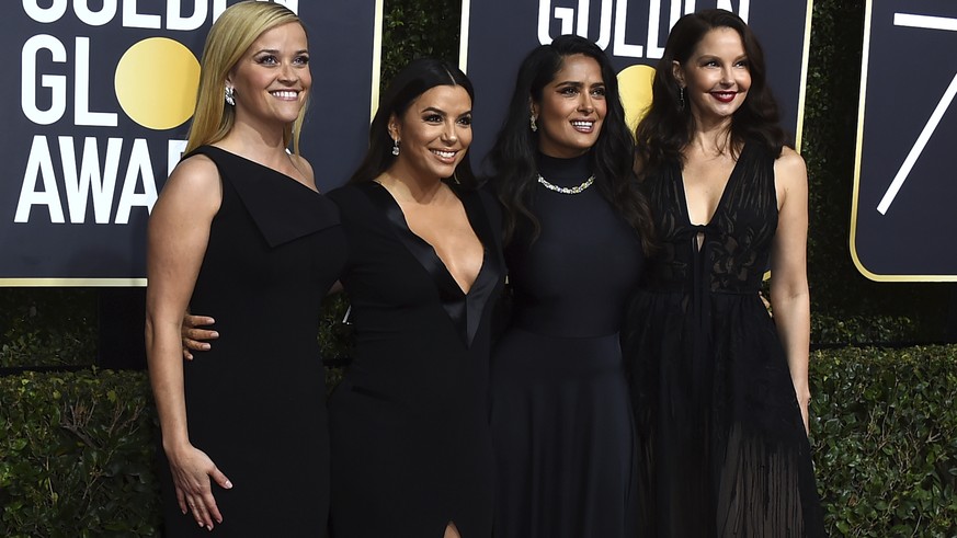 Reese Witherspoon, from left, Eva Longoria, Salma Hayek and Ashley Judd arrive at the 75th annual Golden Globe Awards at the Beverly Hilton Hotel on Sunday, Jan. 7, 2018, in Beverly Hills, Calif. (Pho ...