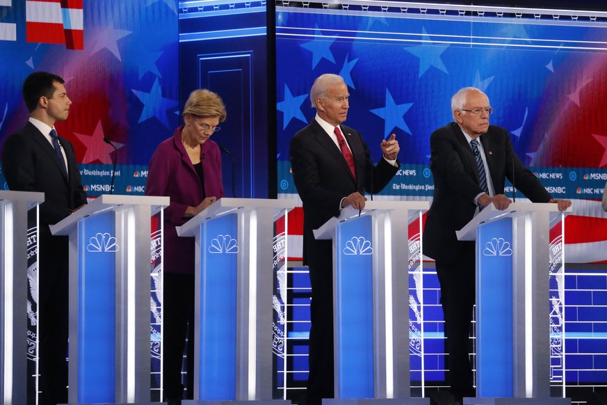 Democratic presidential candidate former Vice President Joe Biden, second from right, speaks as candidates Sen. Bernie Sanders, I-Vt.,, right, and South Bend, Ind., Mayor Pete Buttigieg, left, and Sen ...