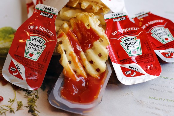 This photo shows Dip &amp; Squeeze ketchup packets at a Robinson Township, Pa., fast food restaurant Monday, March 30, 2015. A Michigan food entrepreneur is trying to convince a federal court jury in  ...