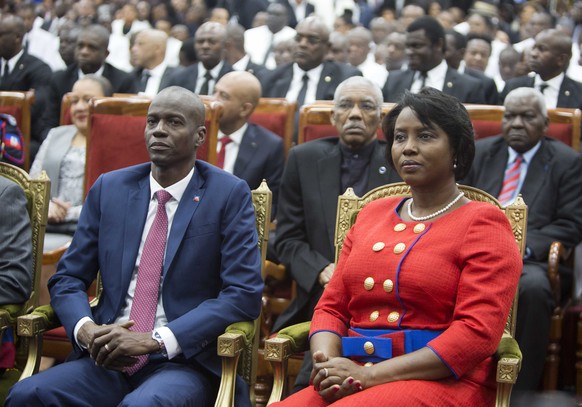 FILE Haiti&#039;s President Jovenel Moise sits with his wife Martine during his swearing-in ceremony at Parliament in Port-au-Prince, Haiti, Tuesday Feb. 7, 2017. A judge investigating the July 2021 a ...
