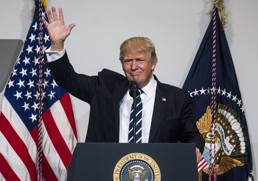 epa05862469 US President Donald J. Trump speaks at the National Republican Congressional Committee March Dinner at the National Building Museum in Washington, DC, USA, 21 March 2017. The long-awaited  ...