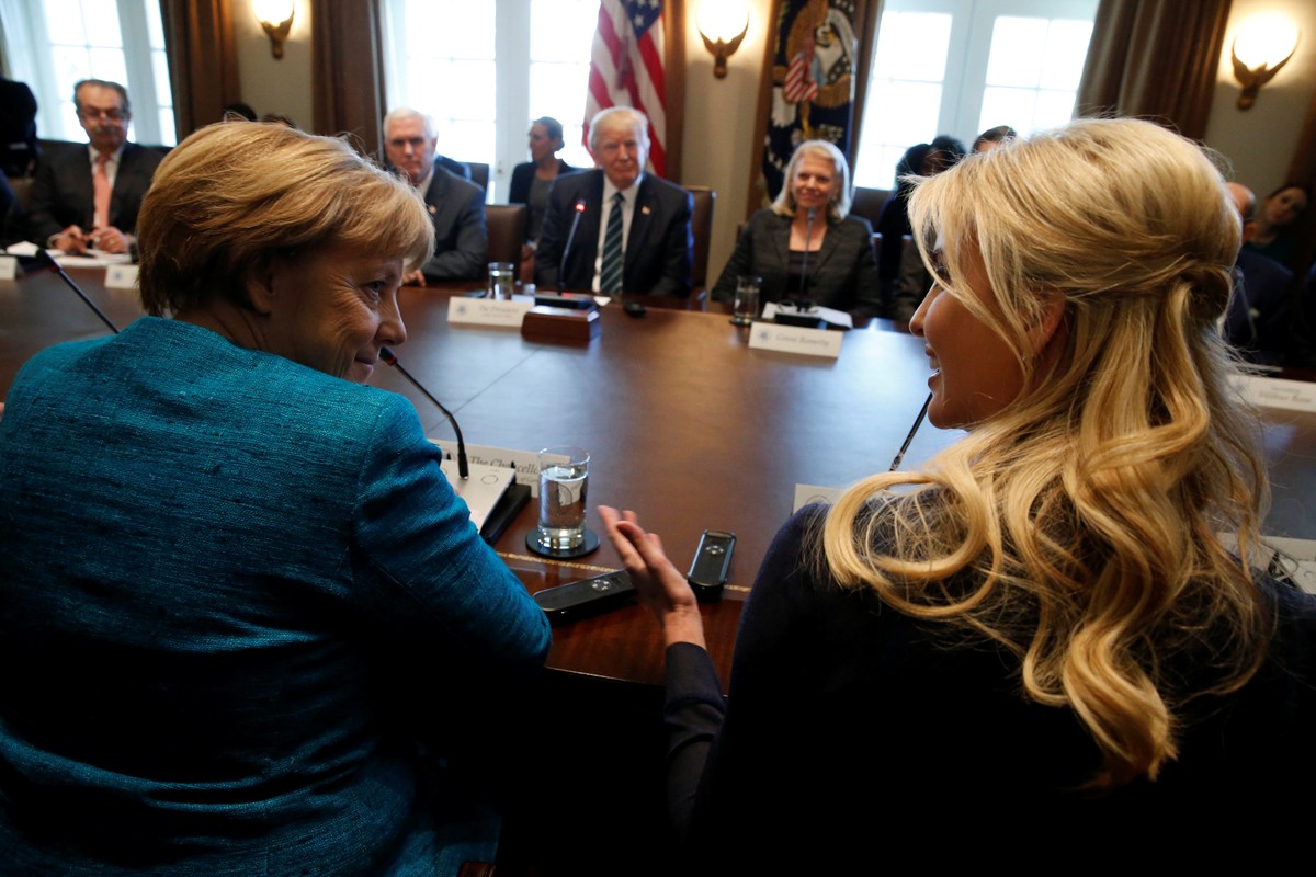 Germany's Chancellor Angela Merkel (L) and Ivanka Trump speak during a roundtable discussion between U.S. President Donald Trump and German and U.S. business leaders on vocational training at the ...