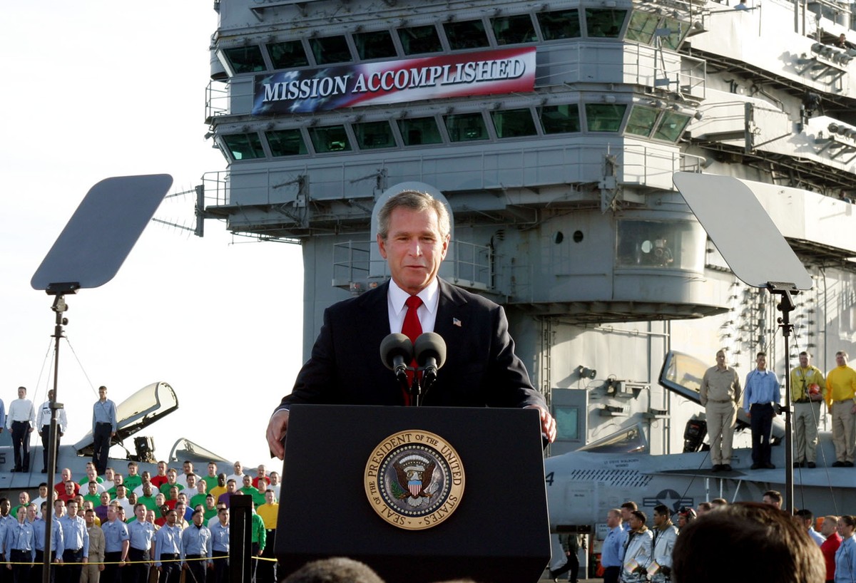 FILE - President Bush declares the end of major combat in Iraq as he speaks aboard the aircraft carrier USS Abraham Lincoln off the California coast, in this May 1, 2003 file photo. The former Soviet  ...