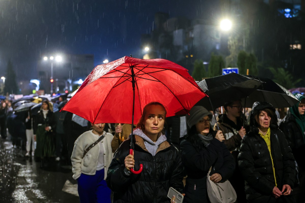 epa11985957 Thousands of protestors march through the streets of Skopje during a protest for justice for the victims who lost their lives in the Kocani fire accident, in Skopje, Republic of North Mace ...