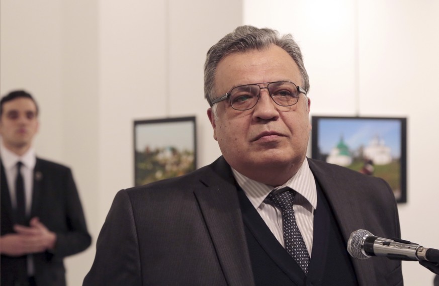 Andrei Karlov, the Russian Ambassador to Turkey, speaks at a photo exhibition in Ankara on Monday, Dec. 19, 2016, moments before a gunman opened fire on him. Karlov was rushed to a hospital after the  ...