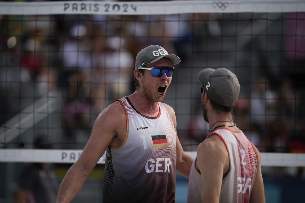 Germany's Nils Ehlers and Clemens Wickler react during the men's semi-final beach volleyball match between Germany and Norway at Eiffel Tower Stadium at the 2024 Summer Olympics, Thursday, A ...