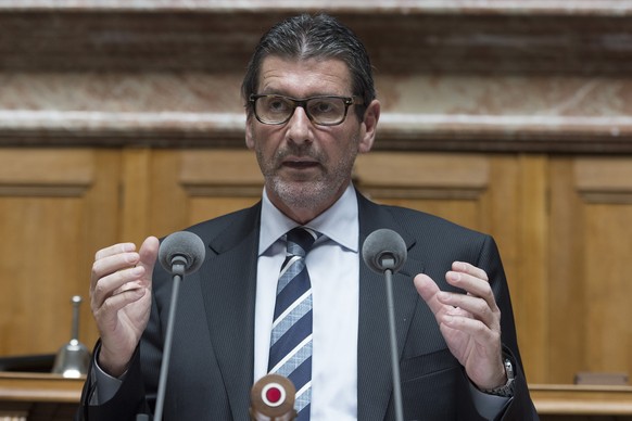 Giovanni Merlini (FDP/TI) aeussert sich zur Volksinitiative &quot;Abschaffung der Pauschalbesteuerung&quot; anlaesslich der Sondersession am Dienstag, 6. Mai 2014 im Nationalrat in Bern. (KEYSTONE/Luk ...