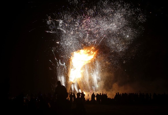 The Man burns during the Burning Man 2014 &quot;Caravansary&quot; arts and music festival in the Black Rock Desert of Nevada, August 30, 2014. Over 65,000 people from all over the world have gathered  ...