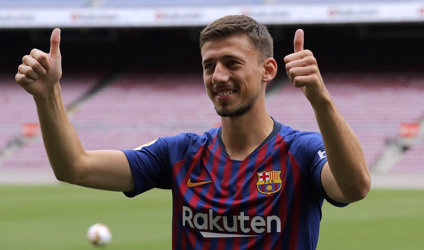 French soccer player Clement Lenglet poses for media during his official presentation at the Camp Nou stadium in Barcelona, Spain, Friday, July 13, 2018. Lenglet has agreed a five-year deal with FC Ba ...