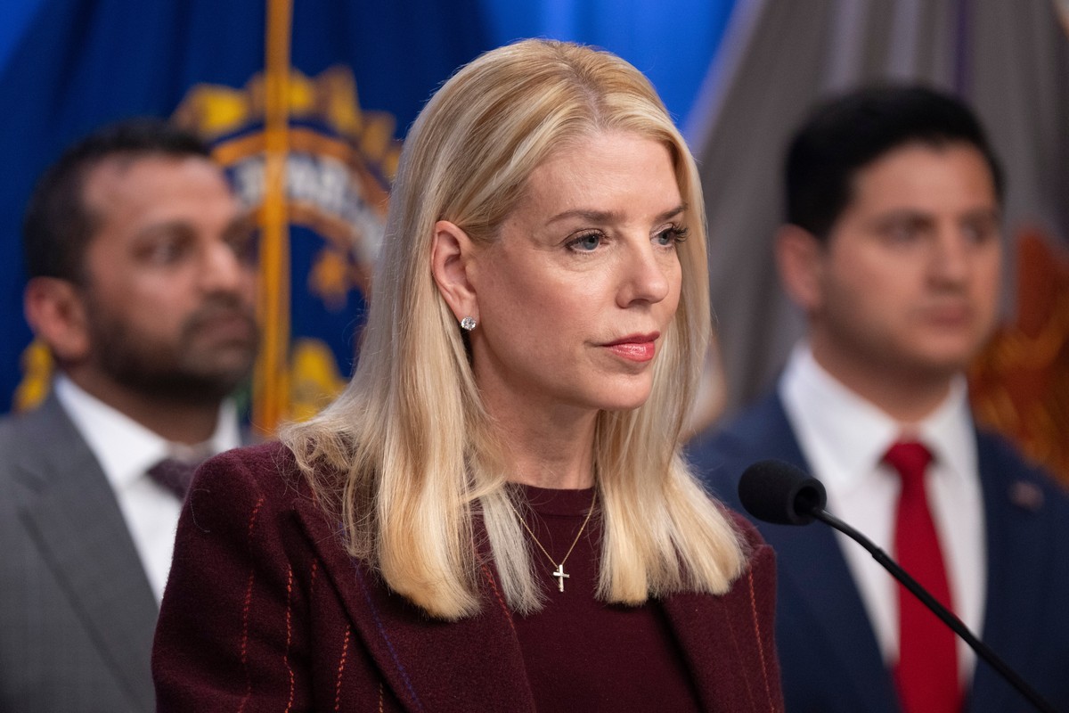 Attorney General Pam Bondi speaks with reporters as FBI Director Kash Patel, left, and Bill Essayli, acting U.S. Attorney for the Central District of California listen during a news conference at the  ...
