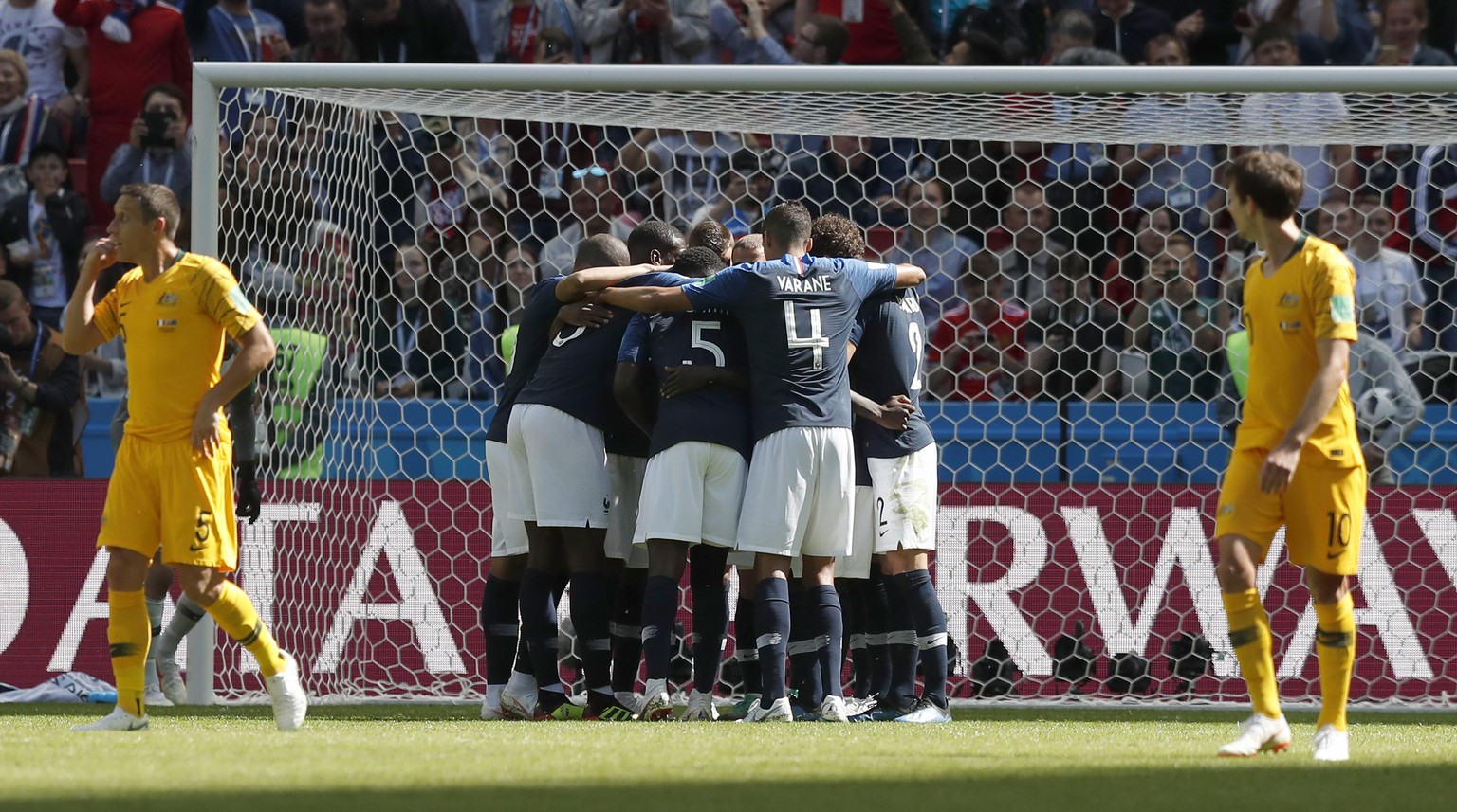 Members of the French team mob France&#039;s Antoine Griezmann after he scored the opening goal from the penalty spot during the group C match between France and Australia at the 2018 soccer World Cup ...