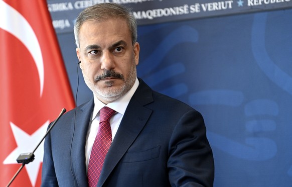 epa11586474 Turkish Foreign Minister Hakan Fidan, accompanied by his North Macedonian counterpart, attends their joint press conference in Skopje, Republic of North Macedonia, 05 September 2024. The T ...