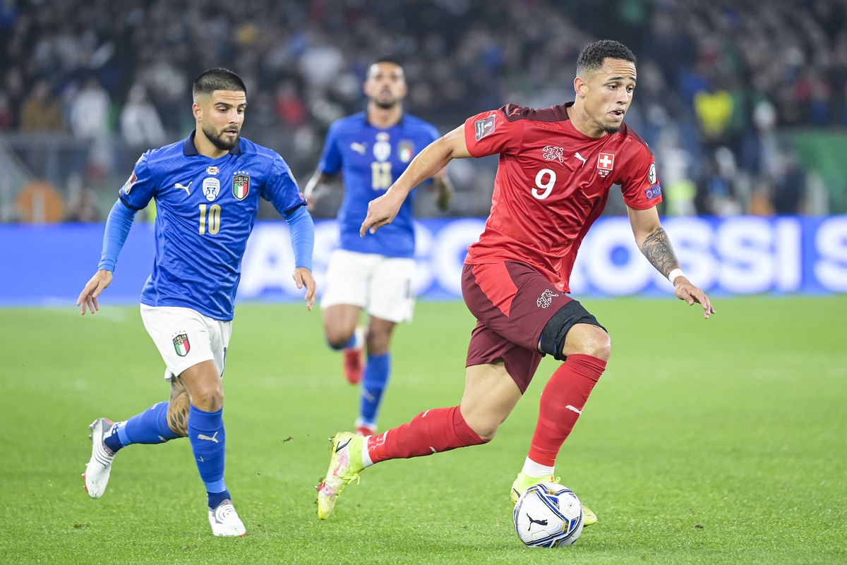 Switzerland's forward Noah Okafor, right, fights for the ball with Italy's forward Lorenzo Insigne, left, during the 2022 FIFA World Cup European Qualifying Group C match between Italy and S ...