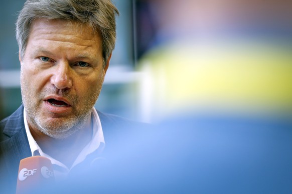 epa10036151 German Minister of Economics and Climate Protection Robert Habeck speaks to the media as he arrives for the Transport, Telecommunications and Energy Council in Luxembourg, 27 June 2022. En ...