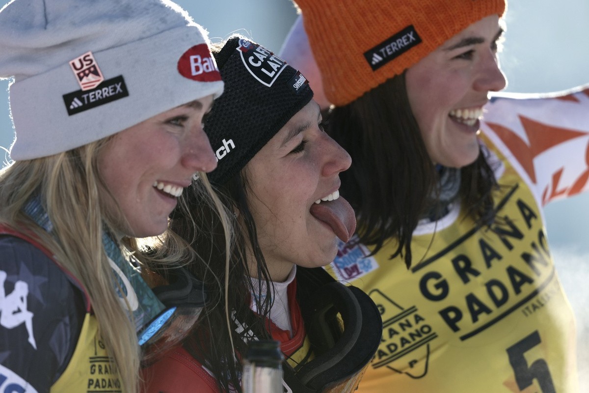 Switzerland's Wendy Holdener, center, winner of an alpine ski, women's World Cup slalom, celebrates on the podium with second-placed United States' Mikaela Shiffrin, left, and third-pla ...