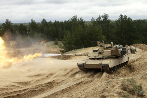 epa04736656 US 3rd Infantry Division soldiers operate an Abrams tank and military equipment during traning exercise in Adazi, Latvia, 07 May 2015. According to the Pentagon, thousands of troops and ma ...