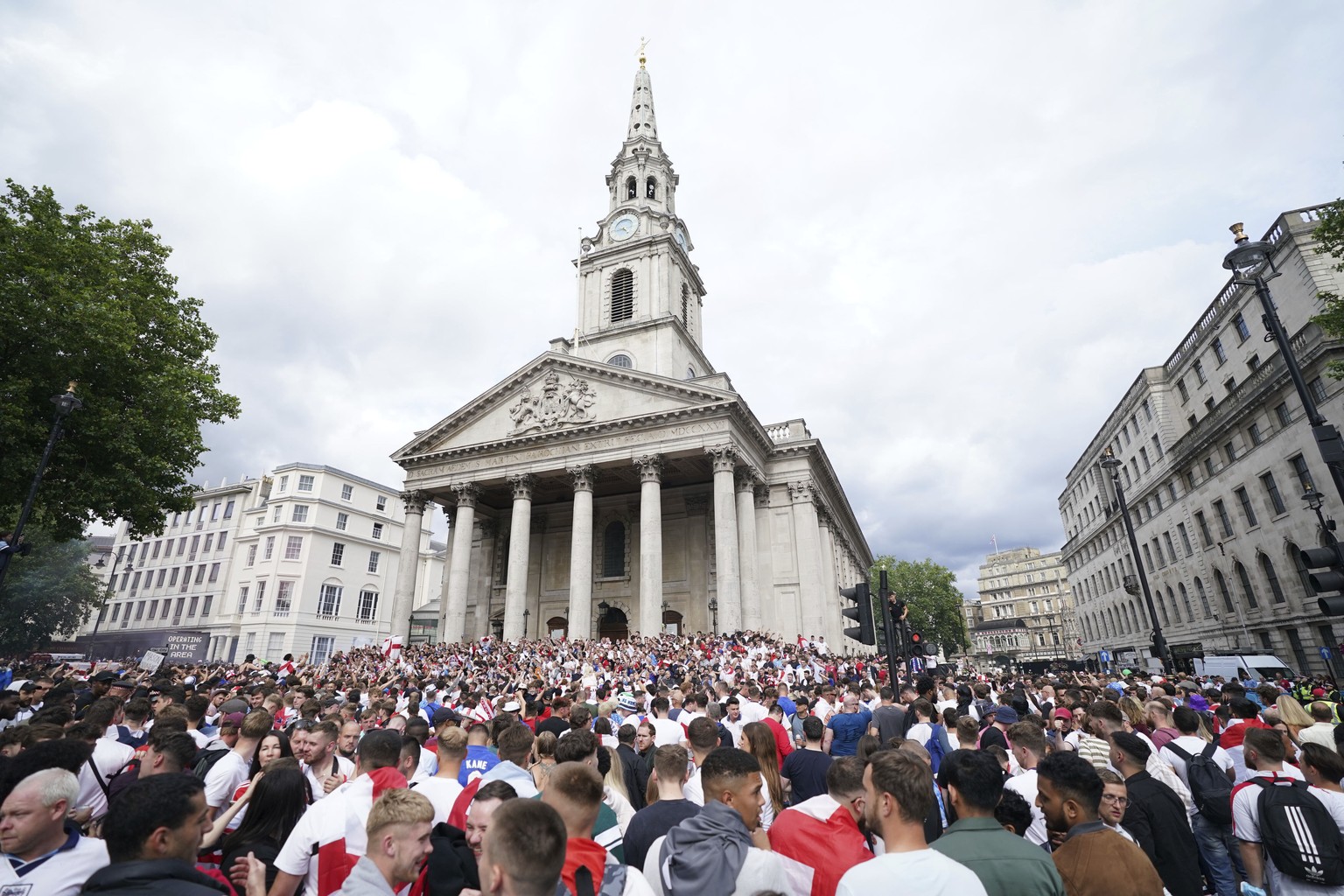 England fans gather outside St Martin-in-the-Fields church, near Trafalgar Square, central London, Sunday July 11, 2021, ahead of the Euro 2020 soccer championship final match between England and Ital ...